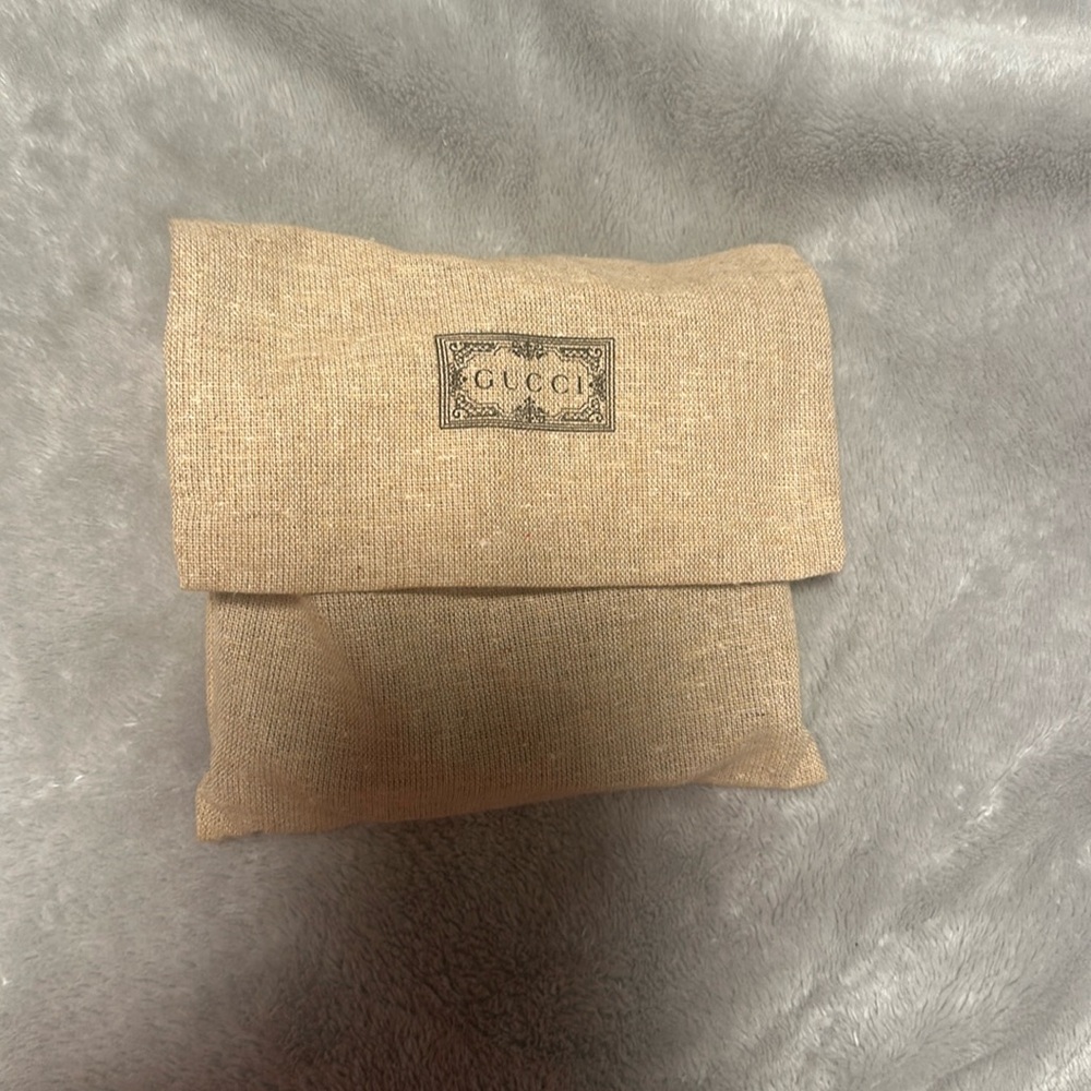 Gucci Diana card case wallet. Luxury black leather. Gold GG logo on front.